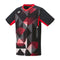 The Yonex 10576 Crew Neck Men's Badminton T-Shirt in black, featuring VeryCool Dry technology, displays a striking geometric pattern with abstract shapes in red, black, and white. Red accents adorn the sleeves and sides for added style and improved breathability.