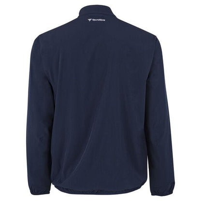 The Tecnifibre Men's Light Badminton Jacket in marine showcases a small logo near the back collar. It is designed with windproof and water-repellent features, providing a simple and casual appearance that makes it suitable for various occasions.