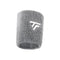 The Tecnifibre Wristband Sweatband XL in silver, from the brand Tecnifibre, showcases a distinctive white embroidered logo featuring two overlapping stylized "T" shapes. This absorbent sweatband is ideal for keeping you dry during intense workouts.