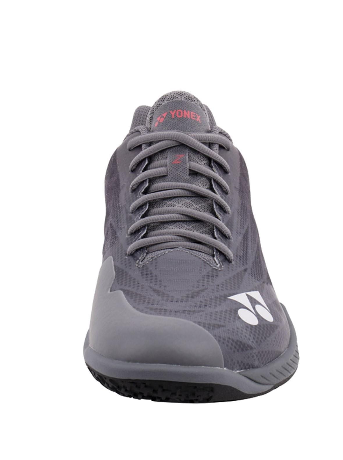 Front view of the Yonex Power Cushion Aerus Z2 Wide men's badminton shoe in dark grey, featuring a patterned design. It includes black laces and displays the iconic Yonex logo on both the tongue and side. The sole is equipped with Yonex Power Cushion technology and has a textured surface for improved grip.