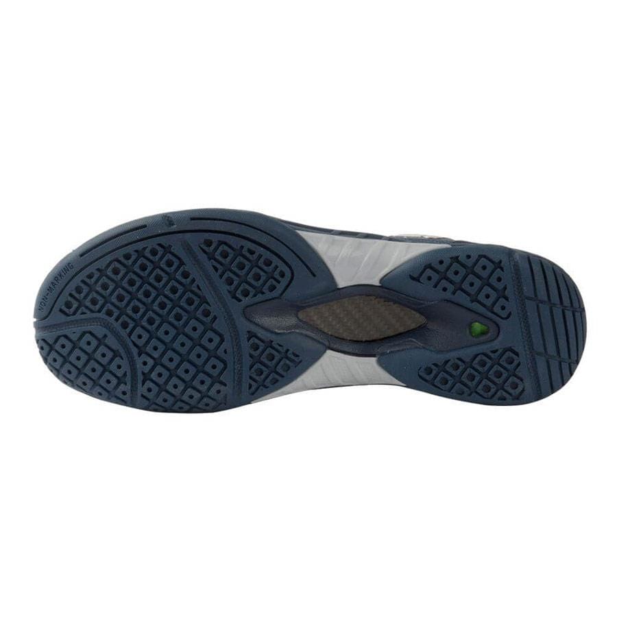 The image displays the outsole of the Victor S82 Men's Badminton Shoes in Medieval Blue, highlighting a textured dark blue pattern with lighter accents and a subtle green dot. The tread design incorporates various geometric shapes to provide traction, further reinforced by wear-resistant TPU for improved durability.