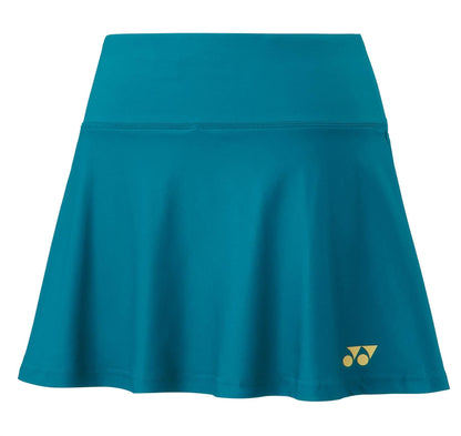 The Yonex 26120EX Women's Badminton Skort in Blue Green offers cooling technology and a wide waistband, accented by a small yellow logo on the lower right side. Made from UV-reducing fabric, it features a smooth texture and a slightly flared silhouette for enhanced style and performance.