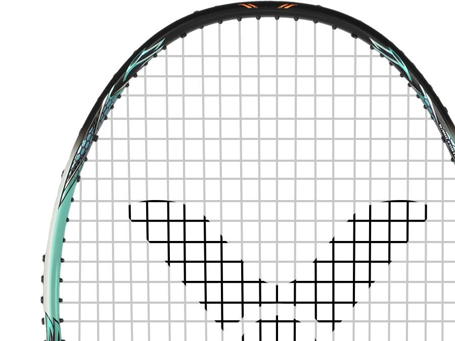 Close-up of a Victor Auraspeed 90K Metallic 4U badminton racket head with a black frame and white strings. A distinctive pattern forms on the strings, while the frame showcases blue and black detailing, offering excellent shock absorption. The image highlights the top portion of this impressive racket from Victor.