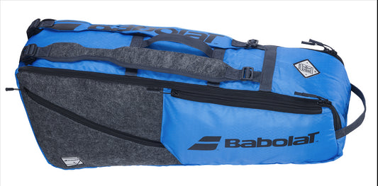 The Babolat RH6 Evo Drive Badminton 6 Racket Bag in Blue/Grey offers multiple compartments, zippers, and a carrying handle, featuring the Babolat logo prominently on the side. It provides a convenient capacity for up to 6 rackets.