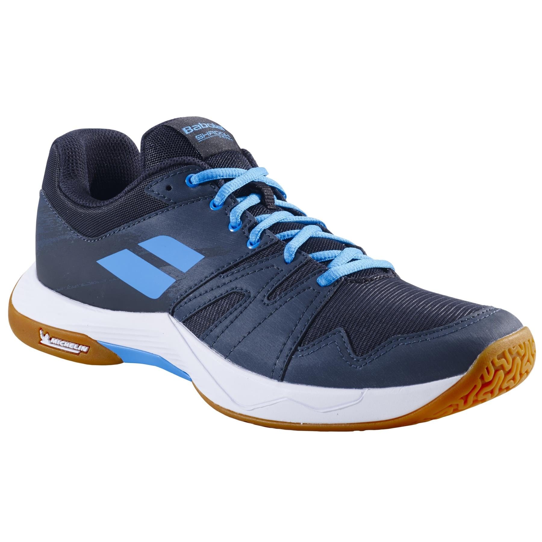 A black and grey Babolat Shadow Team 2 men's badminton shoe, featuring a gum Michelin rubber sole and a white midsole. The shoe includes light blue laces and a textured design for grip and style.