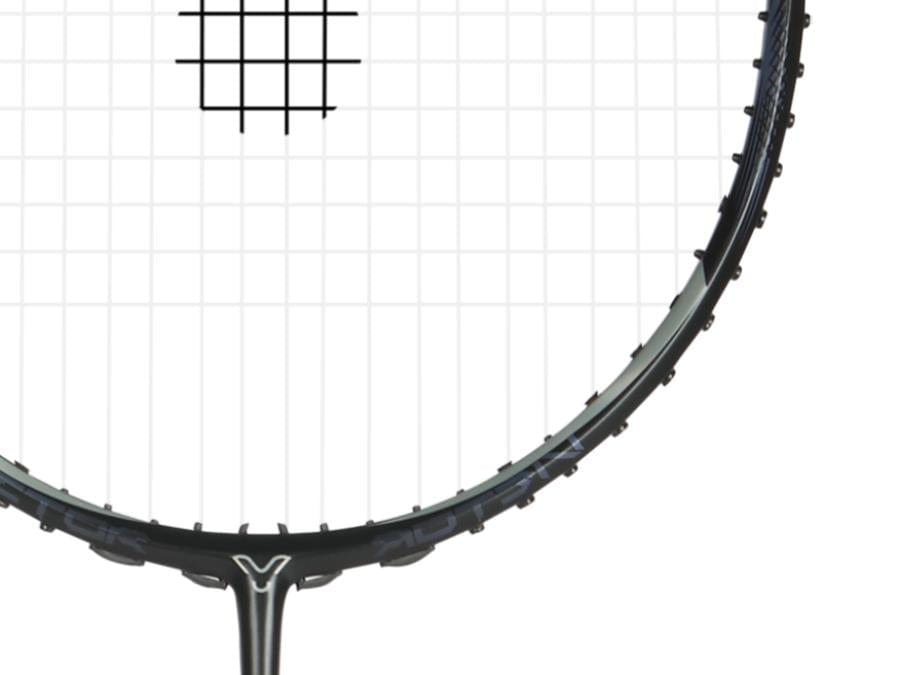 Close-up of a Victor Jetspeed T1 Pro C 4U Badminton Racket head in black and grey, highlighting its intricate strings and a glimpse of the frame enhanced by Aero-Sword technology, all set against a pristine white background.