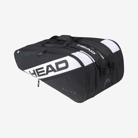 The HEAD Elite 12R Racket Bag - Black White prominently displays the brand "HEAD" and features a spacious design with multiple compartments and zippers. The word "Elite" is printed on the side against a plain light gray background.