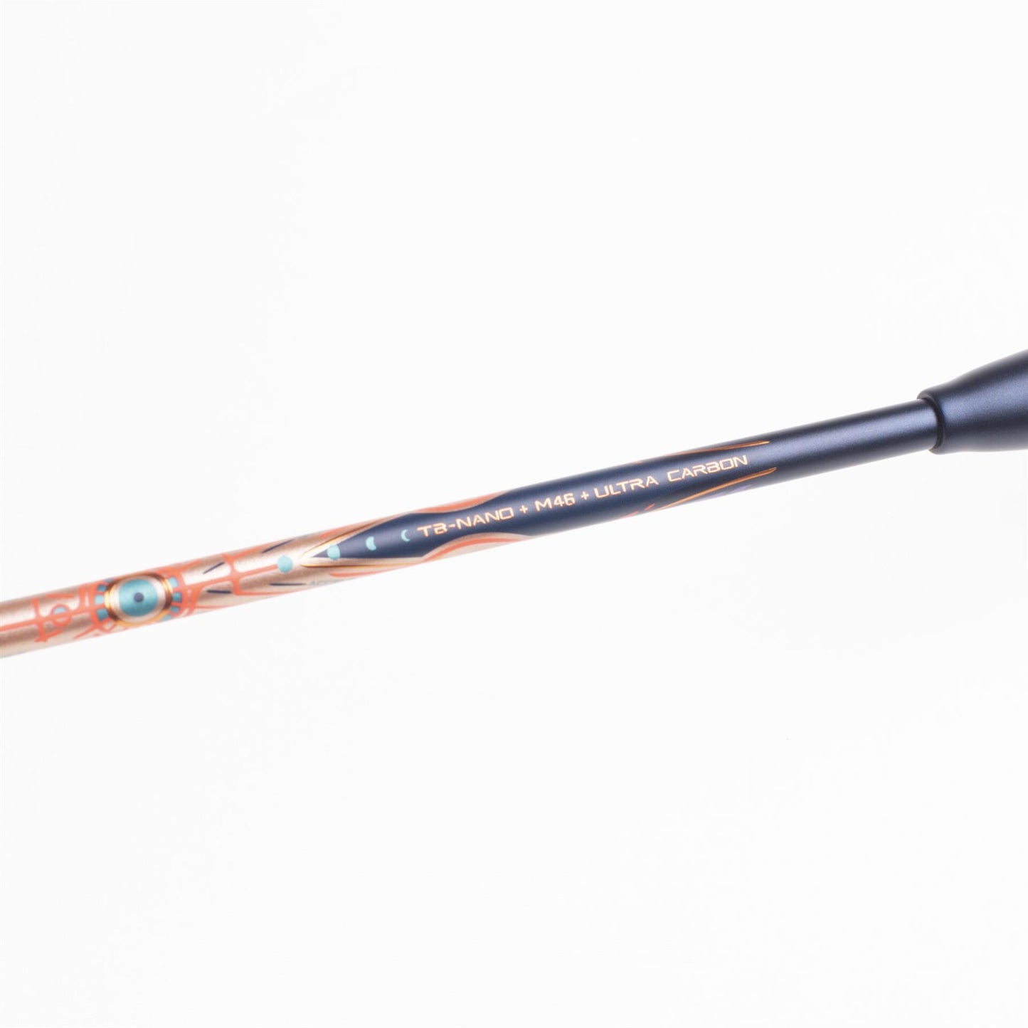 Close-up of a fishing rod with an intricate design on the shaft that ensures precise control. The text "T8-NANO M46 ULTRA CARBON" is prominently displayed on the rod. Adorned with decorative patterns in orange hues and featuring a sleek black handle, its responsiveness is comparable to that of the Li-Ning BladeX 900 Sun Max 4U Badminton Racket - Rose Gold.