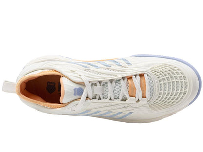 Top view of the K-Swiss Hypercourt Supreme 2 HB Women's Badminton Shoes in Star White/Heather, featuring light blue stripes, orange accents, and a textured sole. The shoes include white laces and an orange inner lining. Its design showcases a detailed mesh-like pattern on the sides with advanced Dragguard 7.0 technology for improved durability.