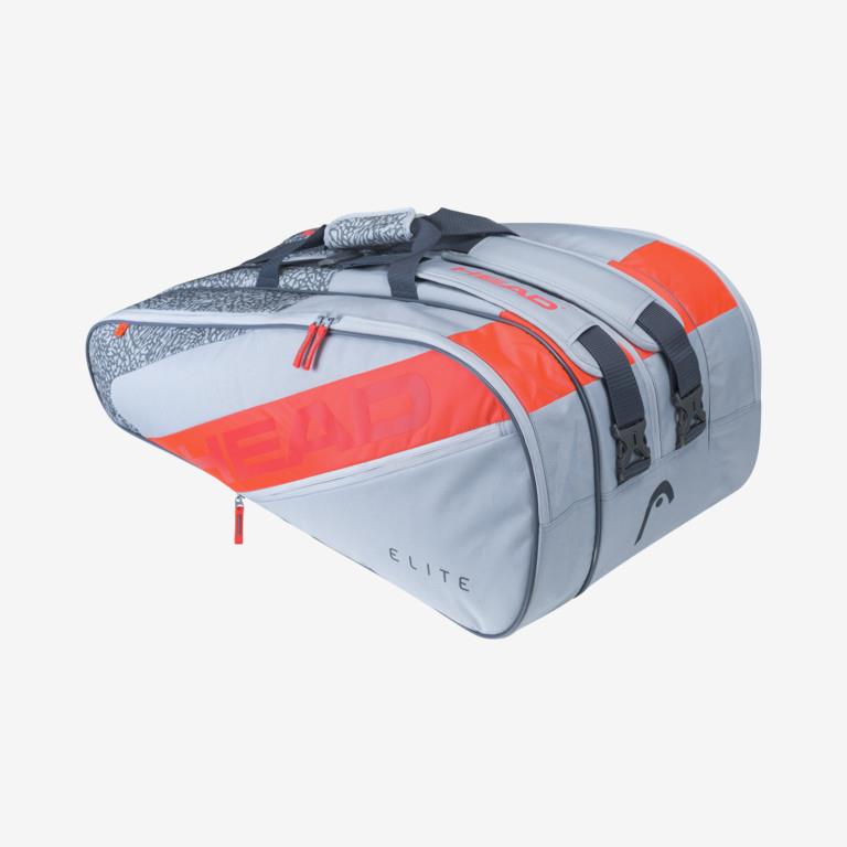 The HEAD Elite 12R Racket Bag in grey and orange is a durable option for tennis players, designed to hold up to 12 rackets. It offers multiple zippered compartments and two black adjustable straps, with "ELITE" prominently displayed on the side.