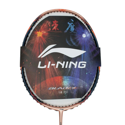 The Li-Ning BladeX 900 Sun Max 3U badminton racket features a decorative cover that exhibits a vibrant, colorful design in red, orange, and blue tones. The brand logo and "Li-Ning" text stand out in white, with "BladeX" elegantly positioned at the bottom of this professional-grade racket.