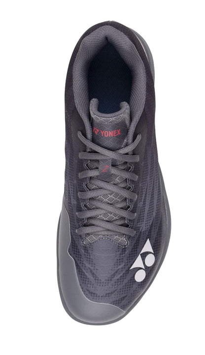 Top view of a dark grey Yonex Power Cushion Aerus Z2 Wide men's badminton shoe. The shoe features a textured upper with a lace-up closure and a slight curve at the heel, enhanced by the Yonex Power Cushion for superior comfort. The Yonex logo is visible at the toe area and on the tongue.