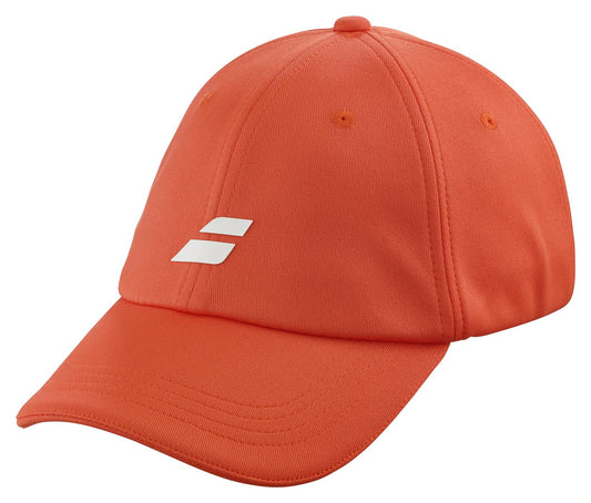 The Babolat Pure Logo Cap - Fiesta Red by Babolat is a baseball cap designed in fiesta red and made from lightweight recycled polyester. It showcases a small white logo on the front, includes a curved brim, visible stitching, and ventilation holes on the top panels for enhanced comfort.