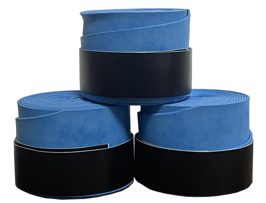 Three rolls of Badminton HQ's Blue Badminton Overgrip, each partially unrolled and stacked in a pyramid formation, provide excellent comfort. The black outer layers improve shock absorption, offering a smooth texture that contrasts with the vibrant blue. Perfect for repurposing as badminton overgrips.