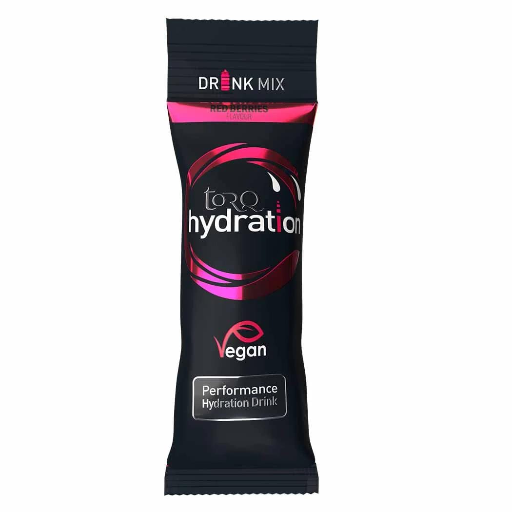 A packet labeled "Torq Hydration Sachet - Red Berries" in black and pink, featuring the Torq brand. This product includes a red berries flavor and displays a "Vegan" symbol, highlighting its advanced hypotonic formulation for superior electrolyte delivery, making it an excellent performance hydration drink.