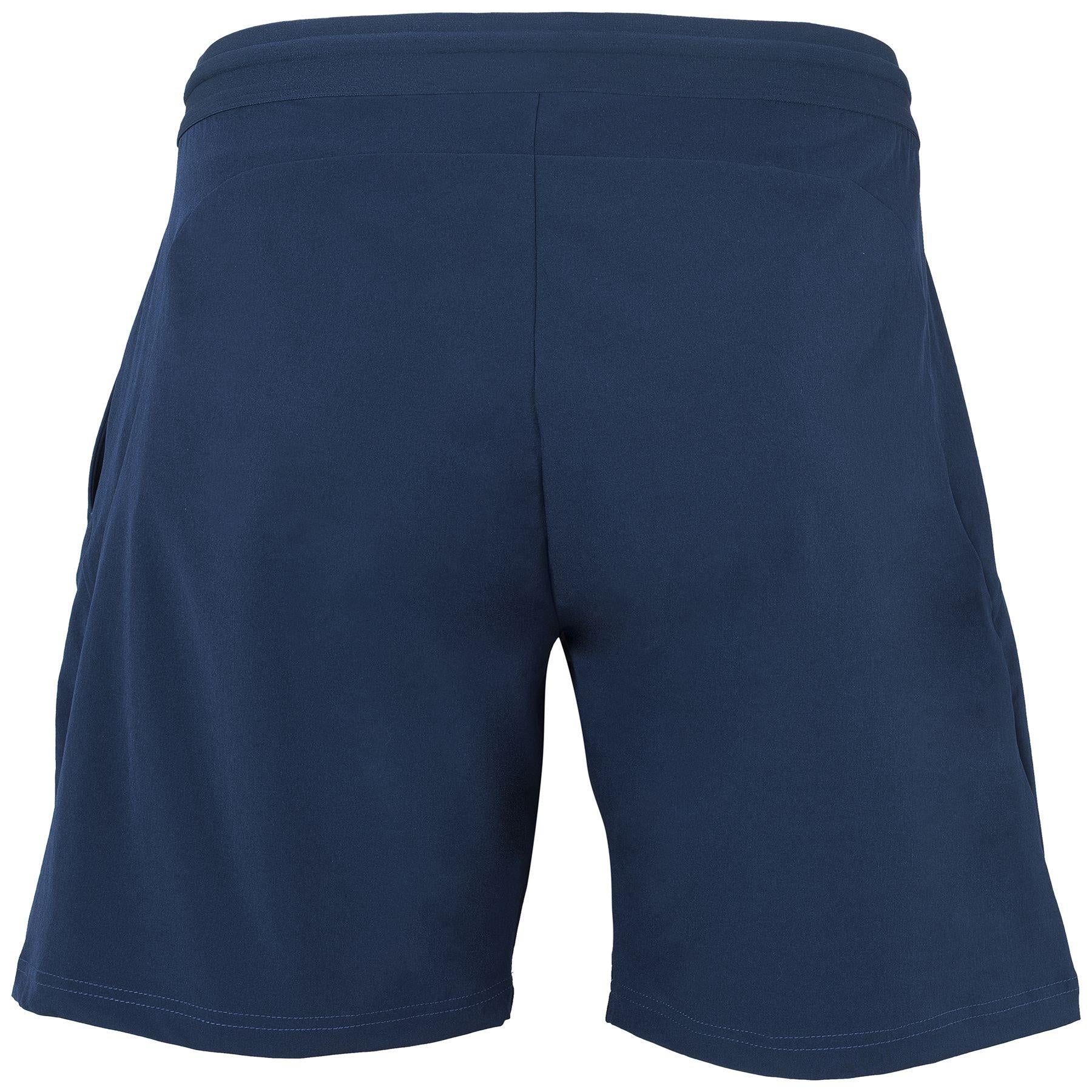 A pair of marine blue Tecnifibre Men's Stretch Shorts displayed from the back. Made with a mix of polyester and elastane, these highly stretchable shorts feature an elastic waistband and a minimalist design without any visible branding or patterns.