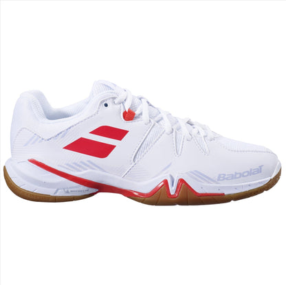 The Babolat Shadow Spirit 2023 Women's Badminton Shoes in white and lavender are designed for badminton enthusiasts. They feature heel cushioning for comfort, a gum-colored sole, and showcase the brand's logo on the side. "Babolat" is also prominently displayed on the outer sole, enhancing their sleek design.