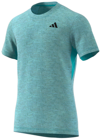 Introducing the ADIDAS Men's Freelift Badminton T-Shirt - Blue by adidas: This light blue t-shirt features short sleeves and a round neckline, designed with moisture-absorbing technology. It boasts a small black adidas logo on the chest and is lightweight and breathable, ideal for sports like badminton or as casual wear.