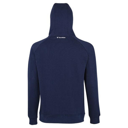 A Tecnifibre Fleece Unisex Badminton Hoodie in marine blue is shown from the back, featuring a hood and long sleeves. The "Tecnifibre" brand name is displayed in white at the upper back. This hoodie is crafted from soft and comfortable fabric, making it ideal for both casual wear and athletic activities.