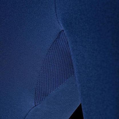 Close-up of the Tecnifibre Mens Team Badminton Short - Marine, showcasing a blue textured fabric with a triangular mesh pattern on one side. This design maximizes lightness while ensuring optimum ventilation, creating a striking contrast in texture and depth.