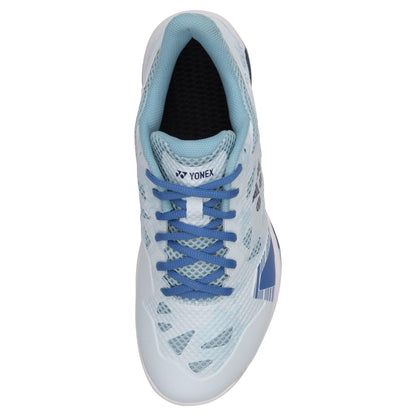 Top view of the light blue Yonex Power Cushion Eclipsion Z3 Wide Men's Badminton Shoe with dark blue laces. This stability shoe boasts a breathable mesh upper with patterned overlays and an elegantly curved design. The Yonex Power Cushion provides superior cushioning and repulsion properties, while the Yonex logo is prominently displayed on the tongue.