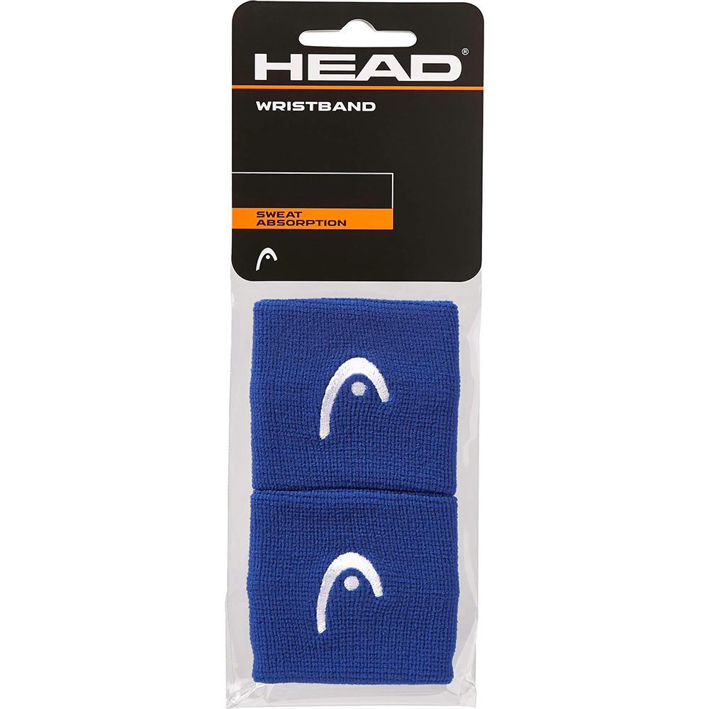 The HEAD 2.5" Badminton Wristband in blue, featuring a white logo and designed for sweat absorption, provides perfect towel-like dryness during intense matches and comes in packaging containing two wristbands.