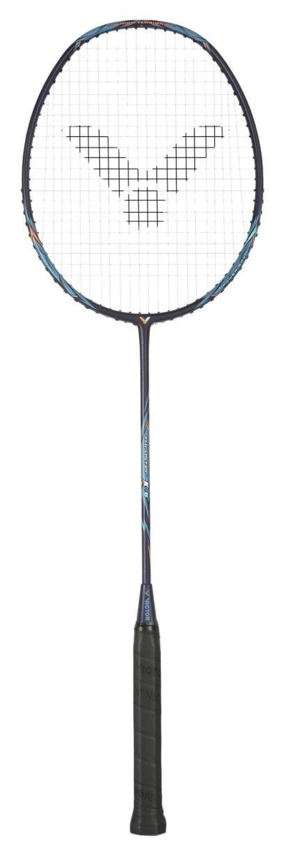 The Victor Thruster K 6 C 4U Badminton Racket - Moonless Night features a black handle and netted head with strings in a stylized black design. Blue and orange accents highlight its frame, enhanced by Power Box technology for top performance on a plain black background.