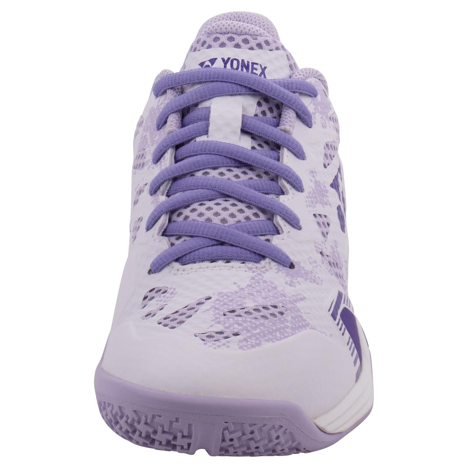 Front view of the Yonex Power Cushion Eclipsion Z3 women's badminton shoe in white and purple. This athletic shoe showcases a mesh design with purple laces, enhanced sole cushioning for added comfort, and the Yonex logo on the tongue. Ideal for those looking to combine style and performance.