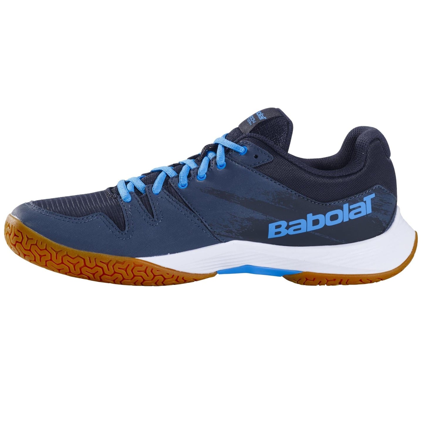 The Babolat Shadow Team 2 men's badminton shoe in black and grey features durable laces and a sturdy brown Michelin rubber sole. The distinctive Babolat logo is prominently displayed on the side, and the detailed tread patterns offer exceptional grip.