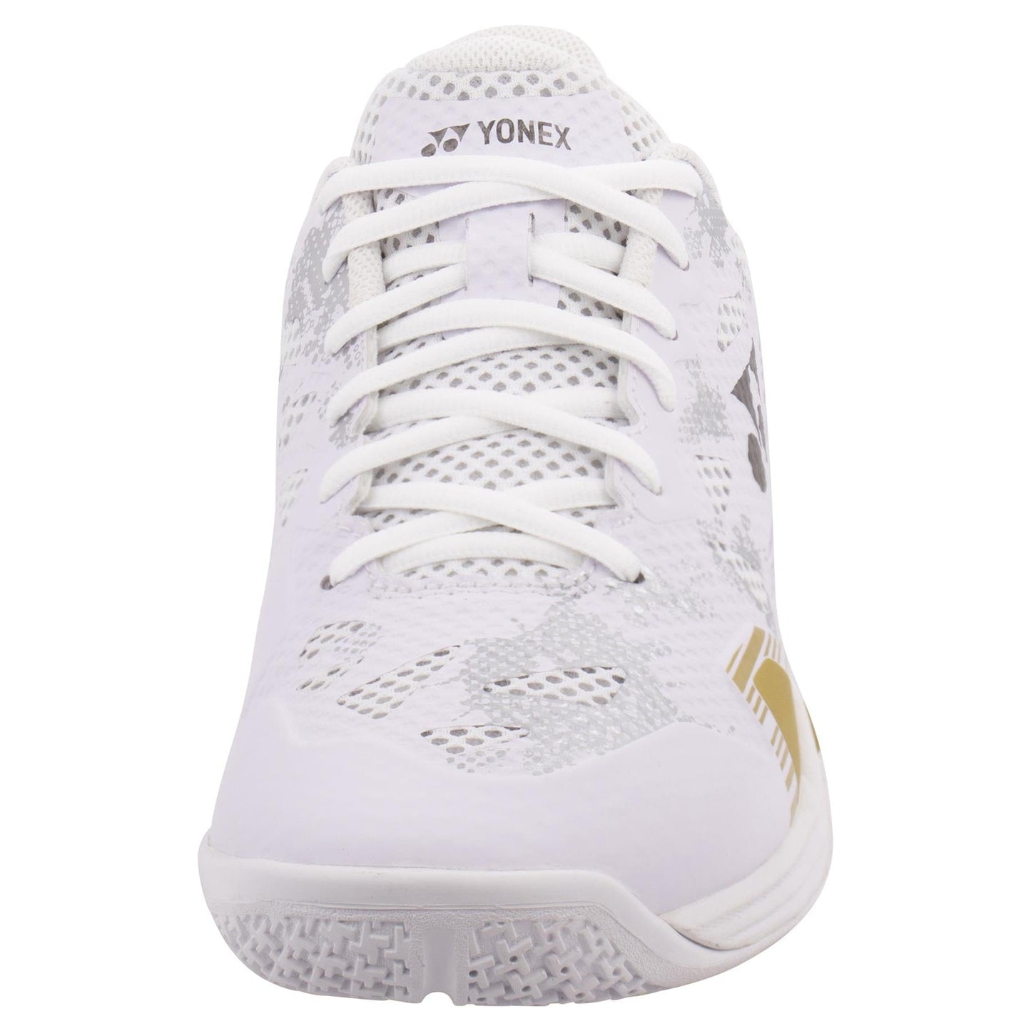 Front view of the Yonex Power Cushion Eclipsion Z3 men's badminton shoe in white with gold accents, highlighting its mesh design and lace-up closure. The shoe is equipped with a textured sole for optimal grip and uses lateral shell technology to provide enhanced stability with every move.
