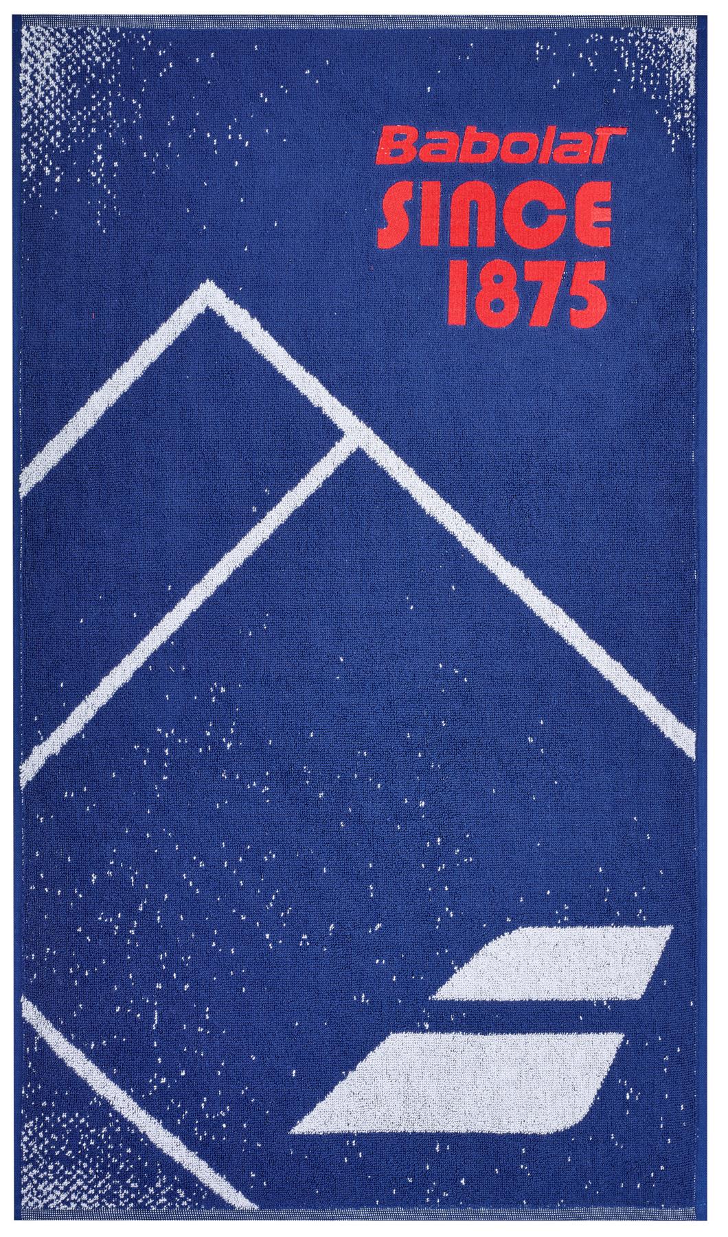 The Babolat Medium Towel - Sodalite Blue is an ideal choice for the court, crafted from 100% cotton. It boasts a blue design adorned with white geometric mountain-like shapes and small speckles. The red lettering proudly displays "Babolat SINCE 1875," along with the signature Babolat logo at the base.