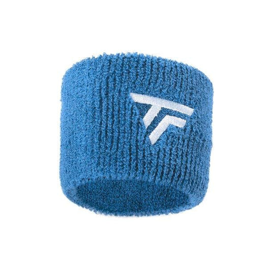 Introducing the Tecnifibre Wristband Sweatband 2 Pack - Azur: a vibrant blue wristband crafted by Tecnifibre, featuring an abstract design highlighted by a bold white logo with overlapping diagonal stripes and a horizontal bar. Made from textured cotton, it serves as an absorbent sweatband ideal for sports and athletic activities.