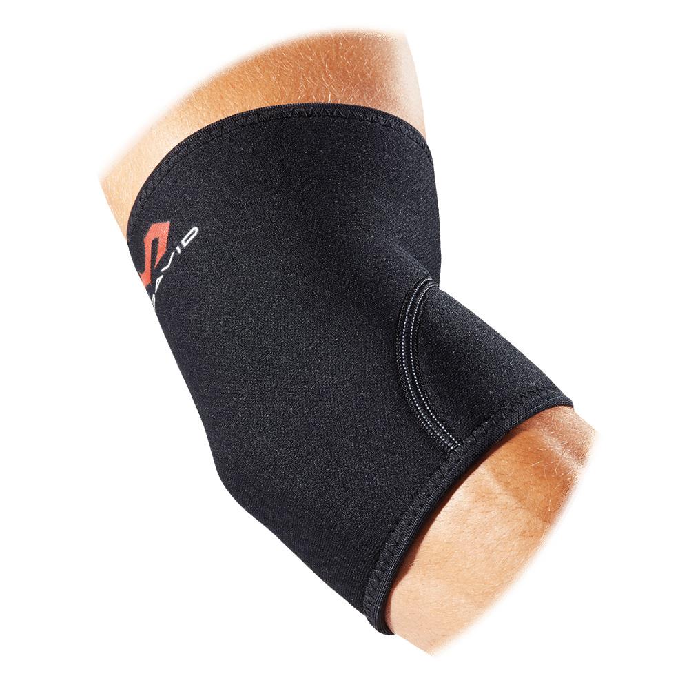 The McDavid Elbow Support, crafted from latex-free neoprene material, is elegantly wrapped around an elbow. This black brace features a small red and white McDavid logo on the side and is designed to deliver effective support and compression therapy.