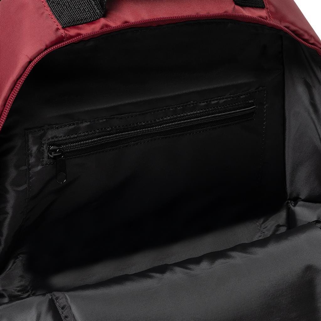 The image displays the interior of the Dunlop CX Club Badminton Backpack in black and red. The inside is lined with black fabric and includes a small zippered pocket on the back panel. The backpack features padded straps for comfort, while its open top reveals a spacious main compartment ideal for securely holding multiple items.