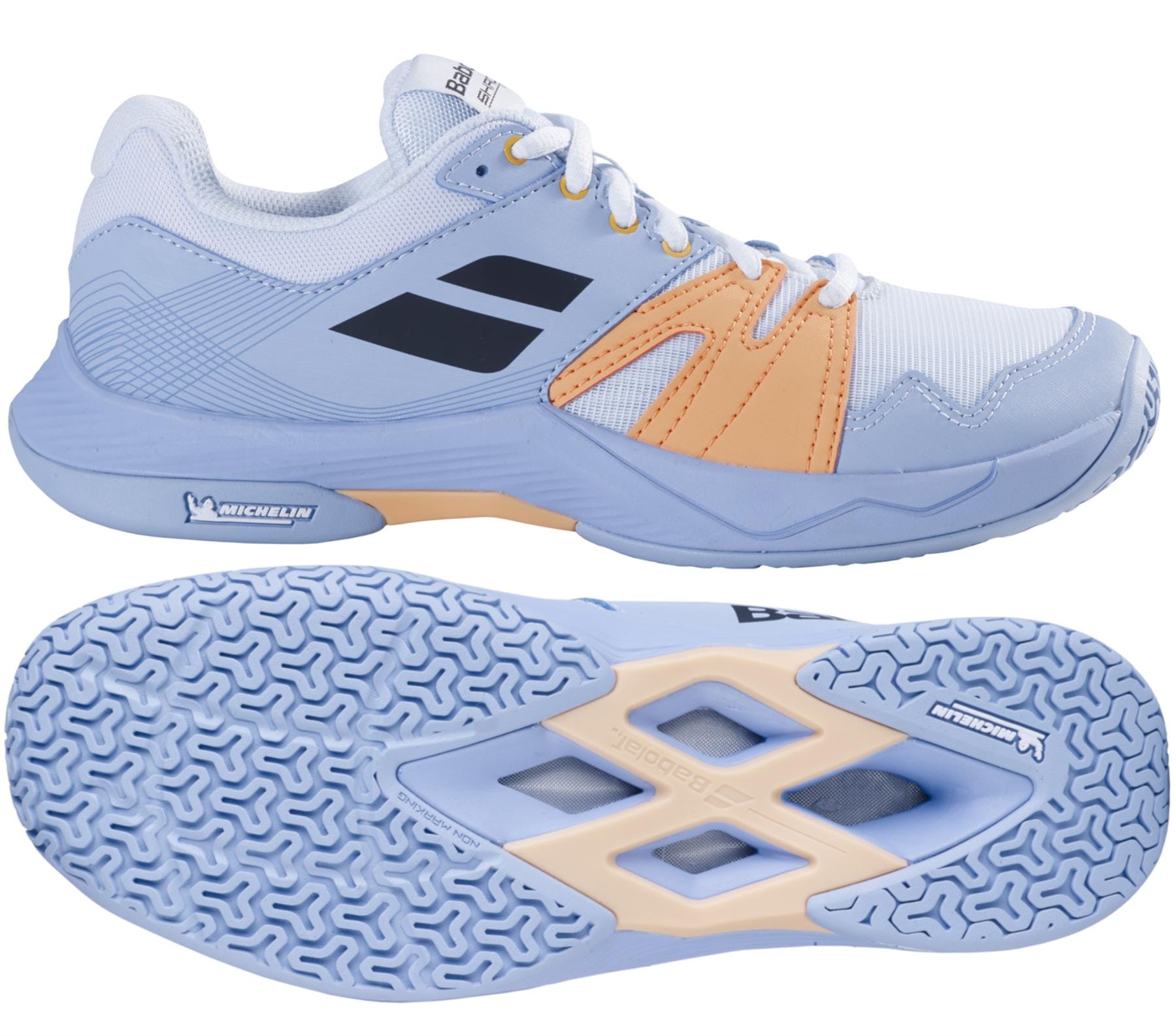 Product Data: Babolat Shadow Team 2 Women's Badminton Shoes in light blue by Babolat. The design integrates mesh and synthetic materials for the upper, accented with two black stripes. The sole is patterned to improve grip and features Michelin rubber branding for added durability, complemented by a vibrant orange design.