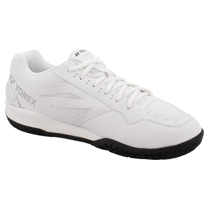 The Yonex Power Cushion Strider Ray Men's Badminton Shoes in white are designed with a black sole that incorporates Power Cushion technology. These sneakers feature a mesh upper and a lace-up design, with the Yonex brand name prominently displayed on the side and tongue. Subtle gray accents complement a textured outsole, providing excellent grip on the court.