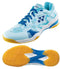 The Yonex Power Cushion Eclipsion X3 Men's Badminton Shoes in light blue showcase a design with darker blue and white patterns. They come with blue laces, a brand logo on the side, and have striking orange and white soles. The label "YONEX" is featured on both the heel and sole. Enjoy exceptional comfort with Yonex Power Cushion technology.