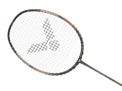 A close-up of the Victor Thruster F Ultra Badminton Racket - Moonless Night by Victor showcases a striking black design on the strings. The frame features an aggressive blend of orange and black, set against a clean white background.