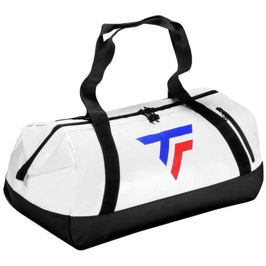 The Tecnifibre Tour Endurance 2023 Badminton Duffle Bag in white and black showcases a blue and red geometric logo on the side. It includes black handles and zipper accents, while its waterproof design is set against a white background.