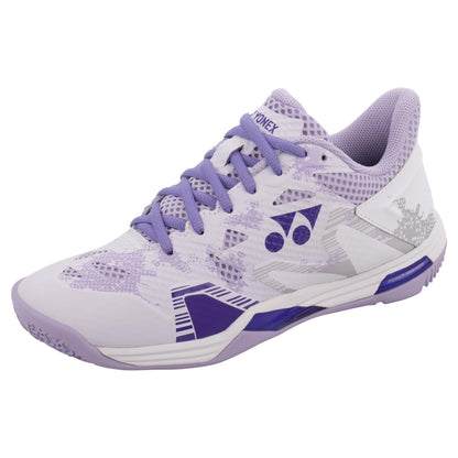 The Yonex Power Cushion Eclipsion Z3 Women's Badminton Shoes in white and purple boast a geometric design with a textured sole for enhanced grip. Incorporating Yonex's Power Cushion technology, these shoes ensure exceptional stability on the court. The design is elegantly finished with purple laces and the iconic Yonex logo displayed prominently on the side.