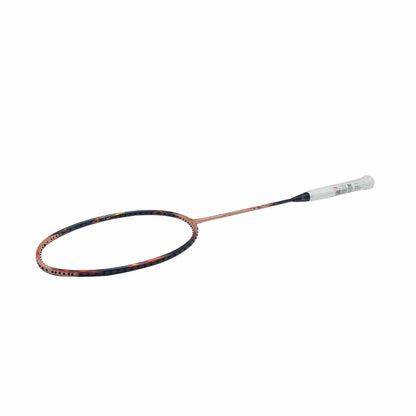 The Li-Ning BladeX 900 Sun Max 3U Badminton Racket - Red Copper, showcasing a light-colored grip and a dark, patterned frame, is presented against a white background.