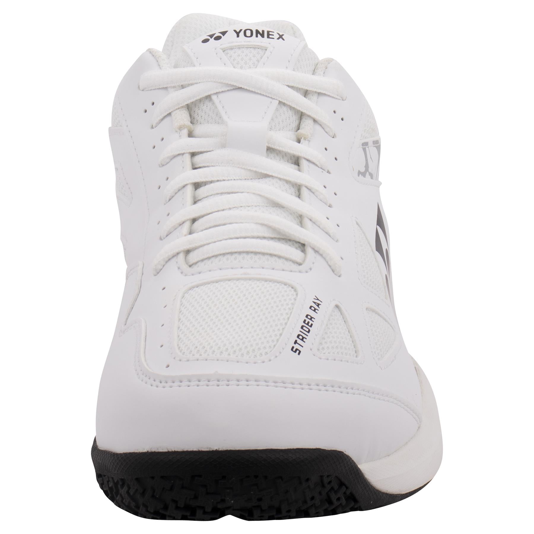 The Yonex Power Cushion Strider Ray Men's Badminton Shoes showcase a sleek front view with a white mesh upper and black sole. This model, celebrated for its Power Cushion technology, displays "STAR CRAY" on the side and features a distinctive logo on the tongue, making it perfect for both tennis and badminton.