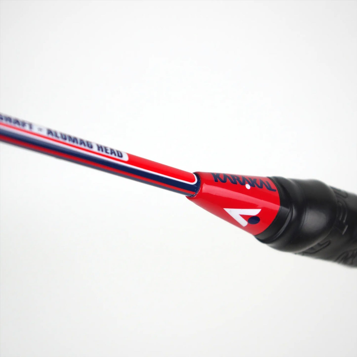 A close-up of a Karakal CB-7 2.1 badminton racket in blue and red.