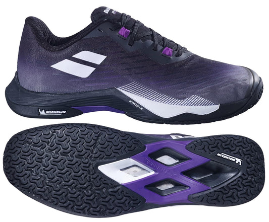 The Babolat Shadow Tour 5 Mens Badminton Shoes in black and purple feature a white Babolat logo, a Michelin-branded textured sole for superior grip, and are ideal for indoor courts. Side and bottom views highlight their design.
