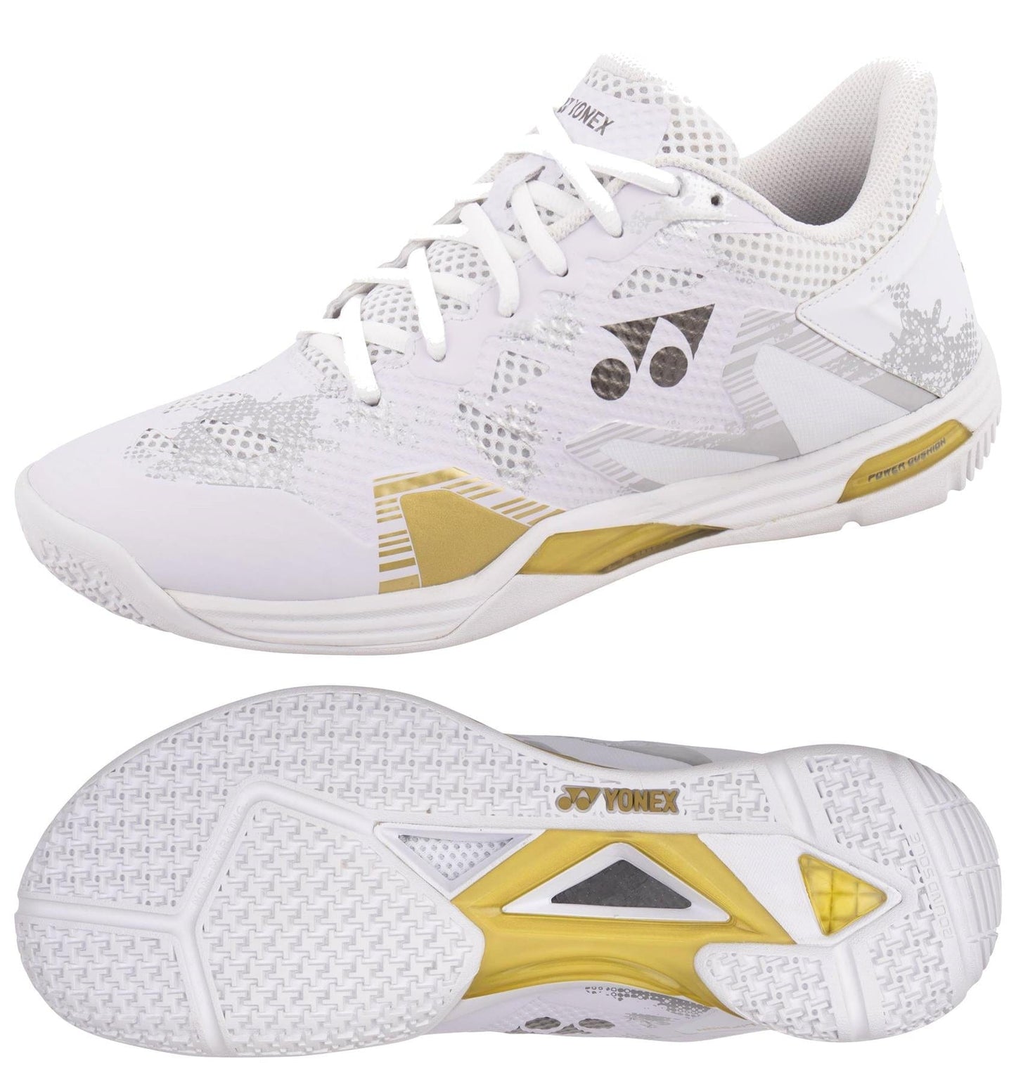 Introducing the Yonex Power Cushion Eclipsion Z3 Men's Badminton Shoes in White and Gold. These stability shoes are designed for badminton or indoor sports, featuring a breathable mesh upper with gold and gray accents. Enhanced with a Lateral Shell for extra support and equipped with a durable sole featuring traction patterns for superior grip, they offer optimal performance on the court.