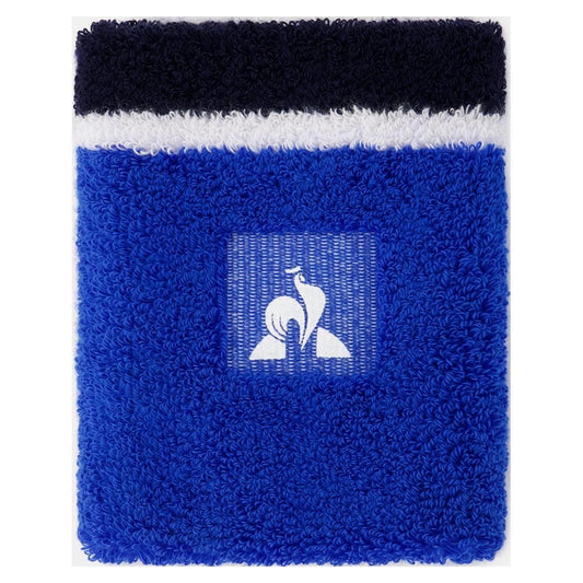 Introducing the Le Coq Sportif Sweatband in Lapis Blue, crafted by the renowned brand Le Coq Sportif. This wristband is available in blue, white, and black and features a central emblem depicting the iconic stylized rooster design. It offers a soft, looped texture characteristic of sportswear wristbands, ensuring effective sweat management during workouts.