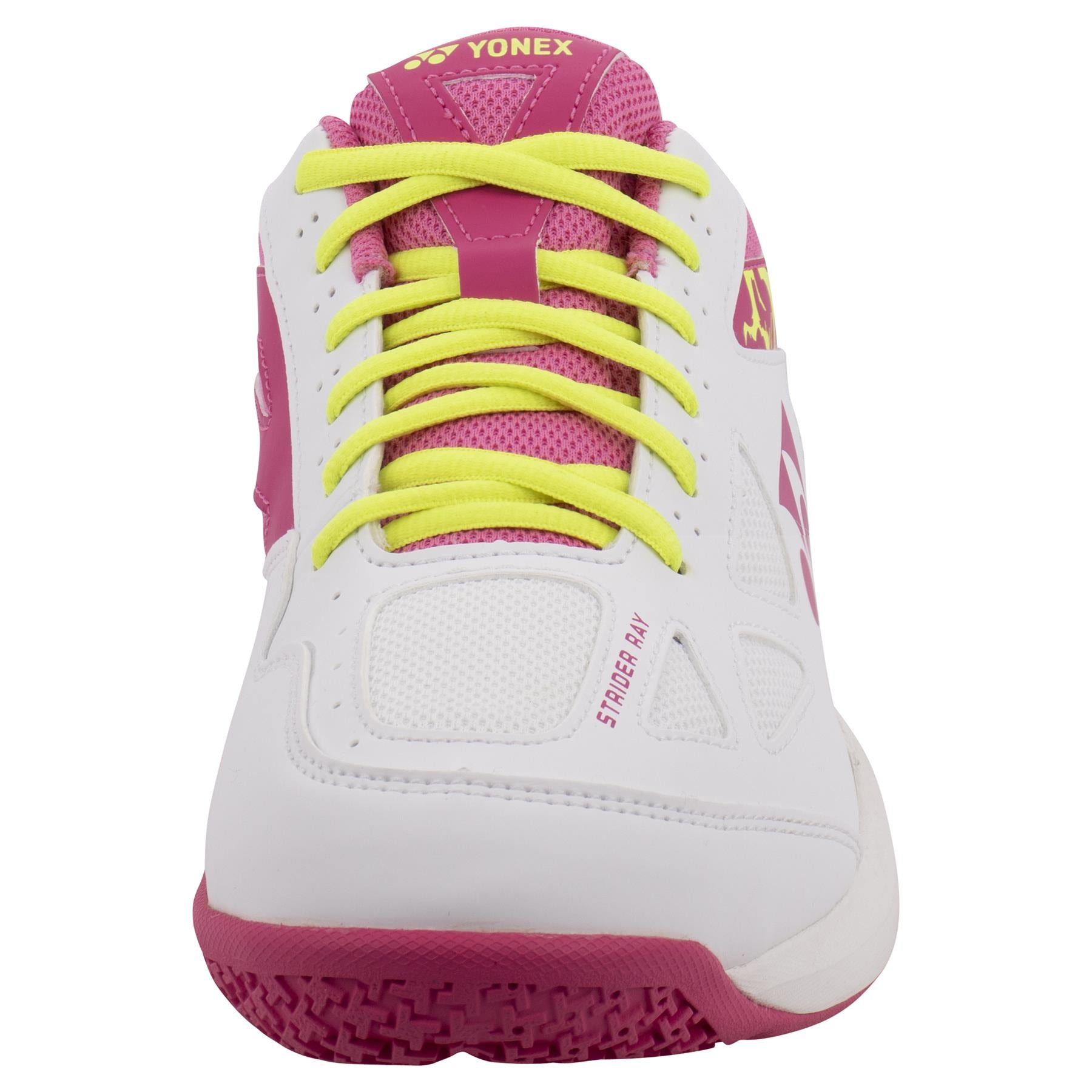 Front view of a white and pink Yonex Power Cushion Strider Ray women's badminton shoe, equipped with yellow laces. The shoe showcases a textured pink Radial Blade Sole and has "STAR ACE" printed on the side.