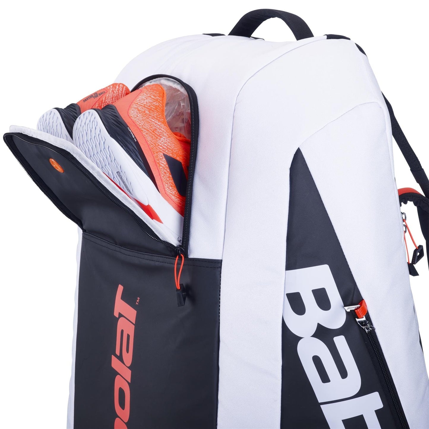 The Babolat RH12 Pure Strike 4th Gen 12 Racket Badminton Bag in white, black, and red highlights an open front pocket with a pair of orange and white tennis shoes peeking out. This innovative design boasts sleek lines, branded text on the side, and is built with isothermal material to maintain your gear at the optimal temperature.