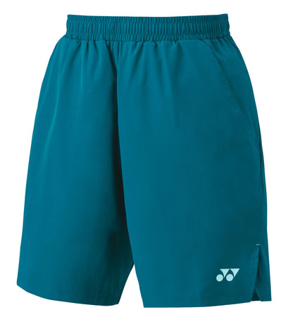 The Yonex 15161EX Men's Badminton Shorts in Blue Green are crafted with a cooling material and feature an elastic waistband and side pockets for enhanced comfort. A small white logo is located near the hem on one leg, providing a stylish touch while ensuring UV reduction.