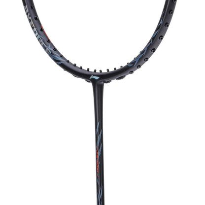 Close-up of a black tennis racket head and part of the shaft, featuring a sleek design with subtle silver patterns. Reminiscent of the Li-Ning Axforce 70 4U Badminton Racket, it highlights the frame's texture and color, showcasing a style that could easily incorporate Wing Stabiliser technology.